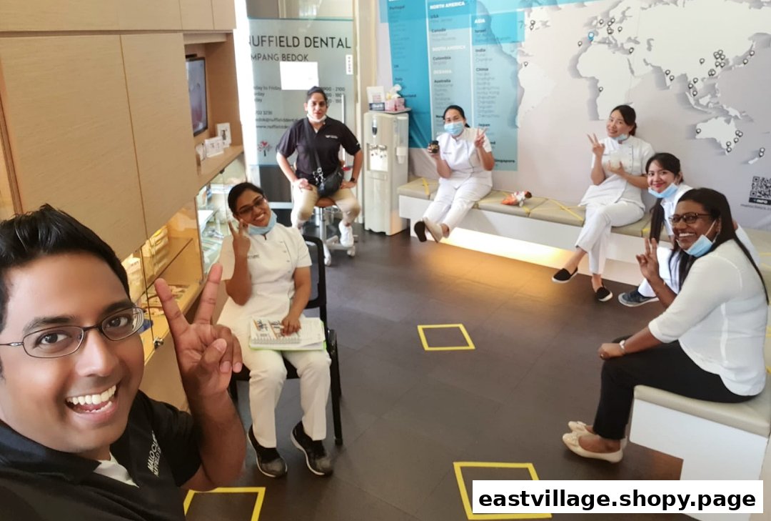 Friendly Nuffield Dental staff members smile and pose in the clinic's welcoming waiting area.