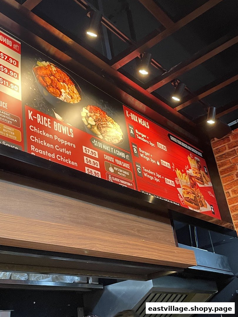 A vibrant menu board displaying Korean fried chicken, rice bowls, and burger combo meals.