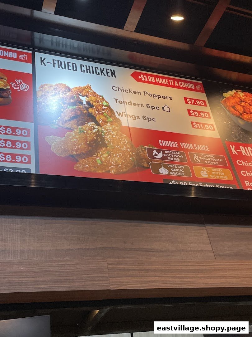 A digital menu board displaying Korean fried chicken options and sauces.