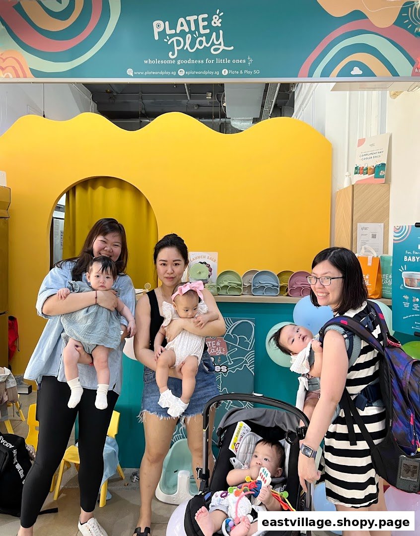 Women and babies enjoying the vibrant interior of Plate & Play, a shop for little ones.