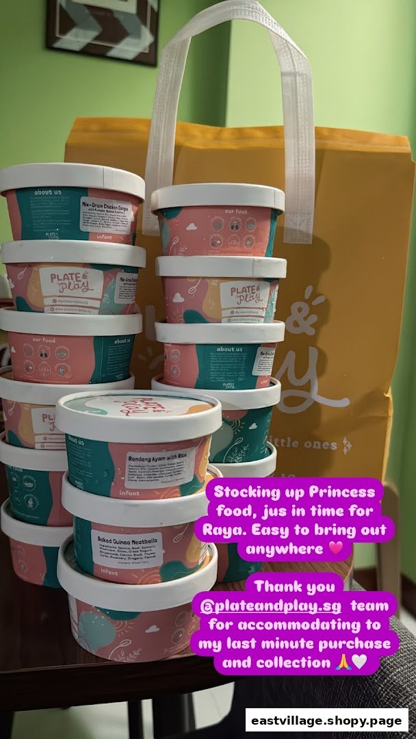 Stacked containers of baby food from Plate & Play next to a branded shopping bag.