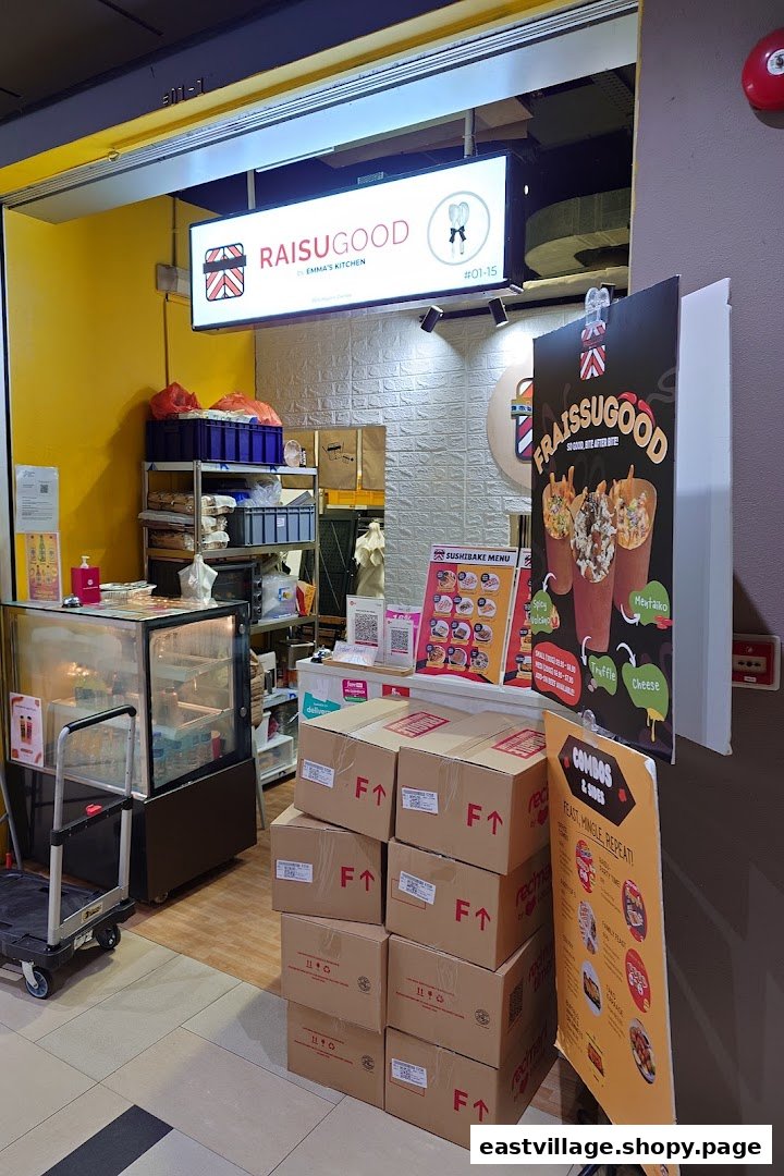 The storefront of RaisuGood by Emma's Kitchen, featuring signage and promotional displays.