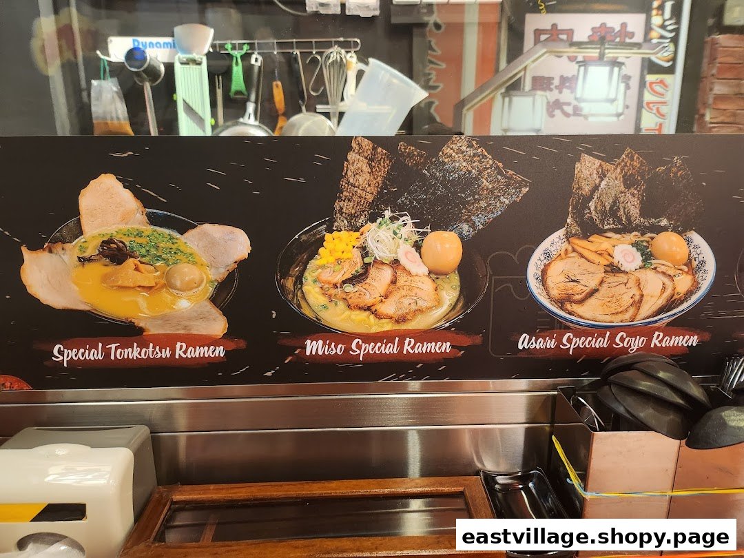 A vibrant display board showcasing three different ramen dishes with their names.