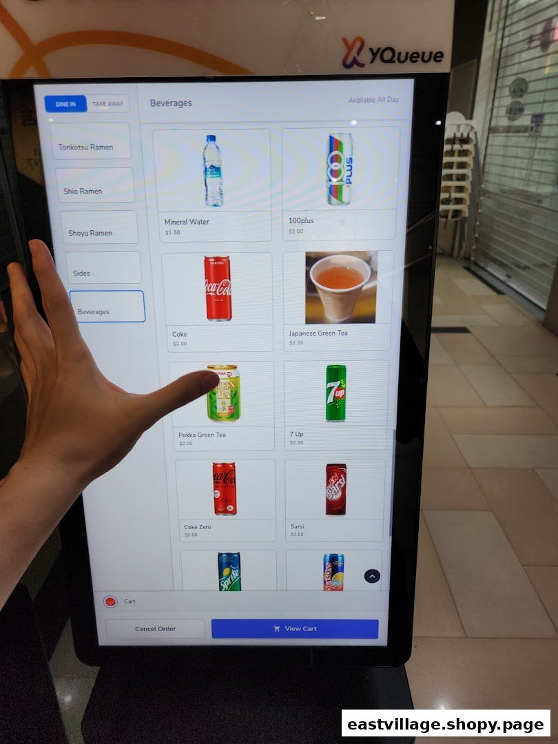 A digital self-ordering kiosk displaying beverage options for a ramen shop.