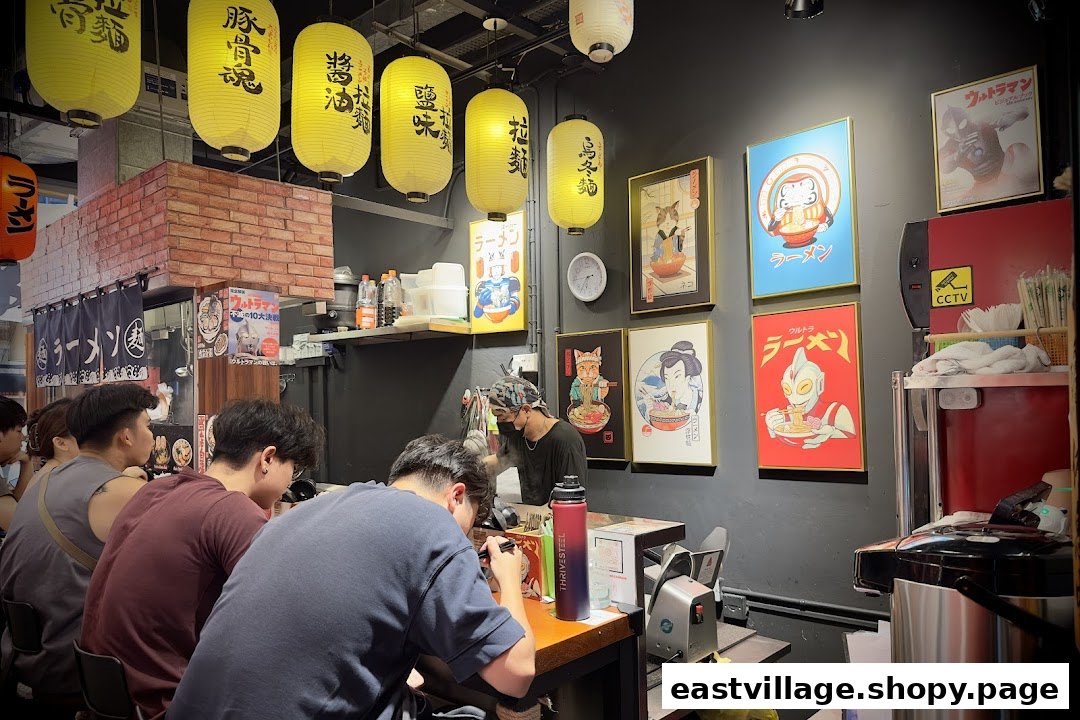 Customers enjoy authentic ramen at a vibrant, counter-style Japanese eatery.