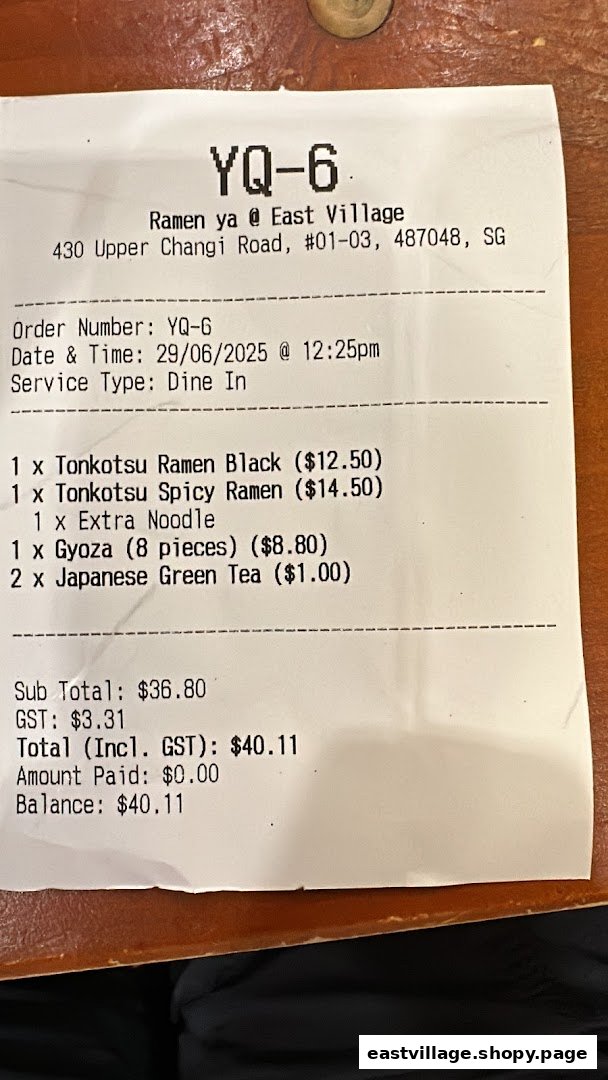 A detailed receipt from Ramen-ya @ East Village, showing ramen, sides, and drink orders with prices.