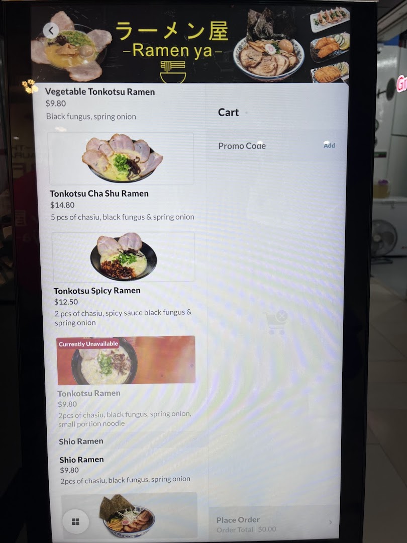 A digital menu display showcasing various ramen dishes and prices from Ramen-ya.