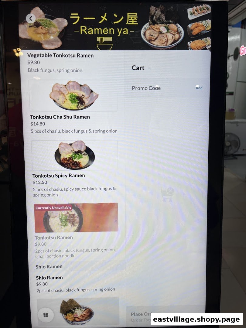 A digital menu display showcasing various ramen dishes and prices from Ramen-ya.