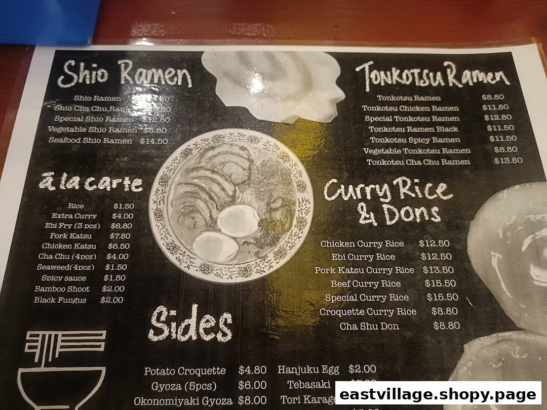 A detailed menu displaying various ramen, curry rice, and side dishes with prices.