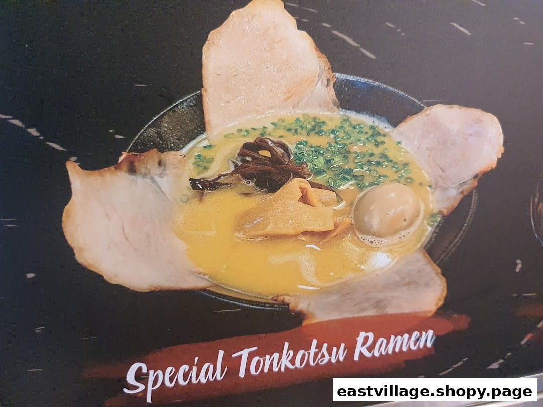 A close-up of a rich Special Tonkotsu Ramen bowl with pork, egg, and various toppings.