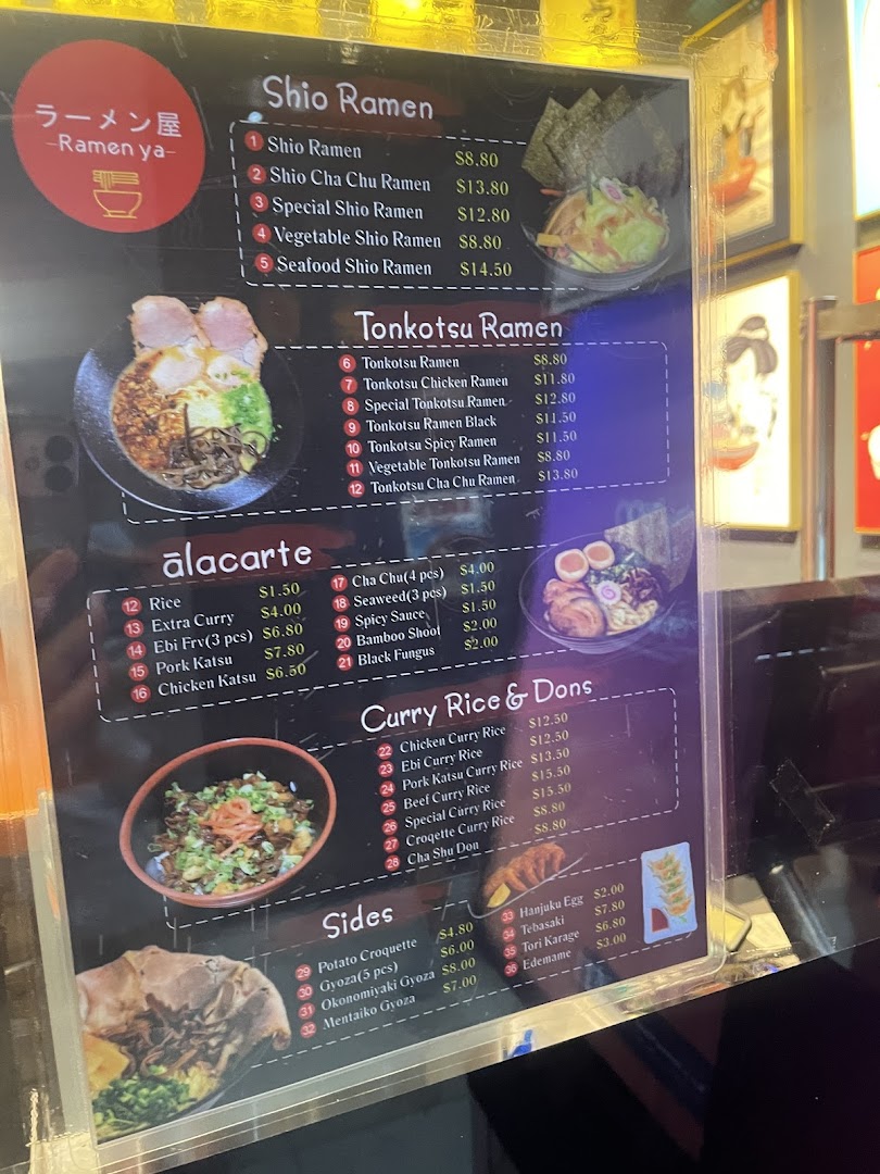 A detailed menu board for Ramen-ya, featuring various ramen, curry, and side dishes with prices.