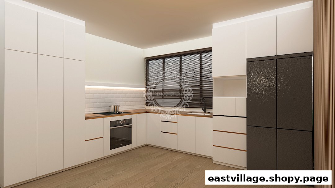 A modern kitchen interior featuring white cabinetry, wooden countertops, and integrated appliances.