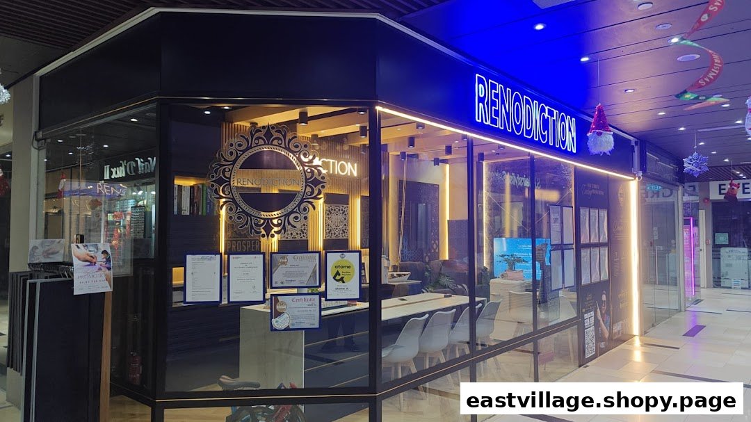 The brightly lit exterior of RENODICTION PTE. LTD., showcasing its modern design and interior.