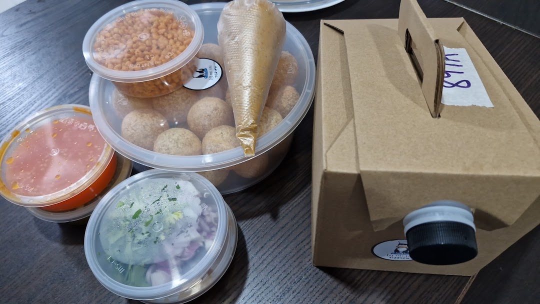 Assorted takeout food containers from ROTIFIFI, including snacks, sauces, and a beverage box.
