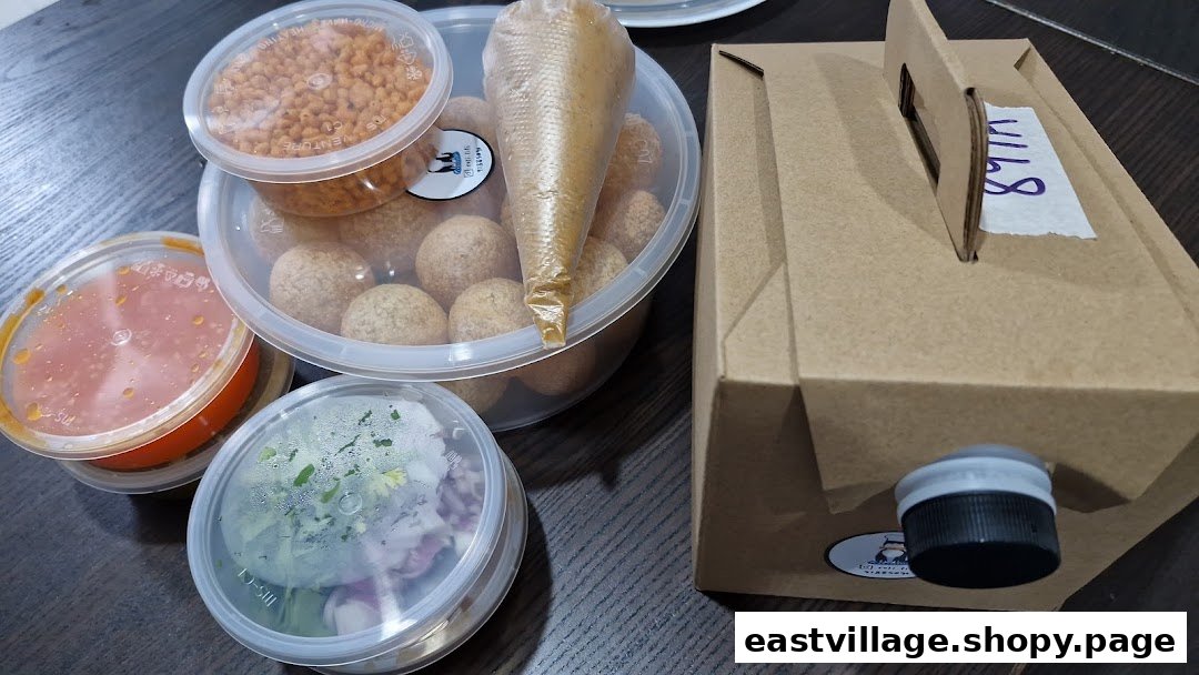 Assorted takeout food containers from ROTIFIFI, including snacks, sauces, and a beverage box.