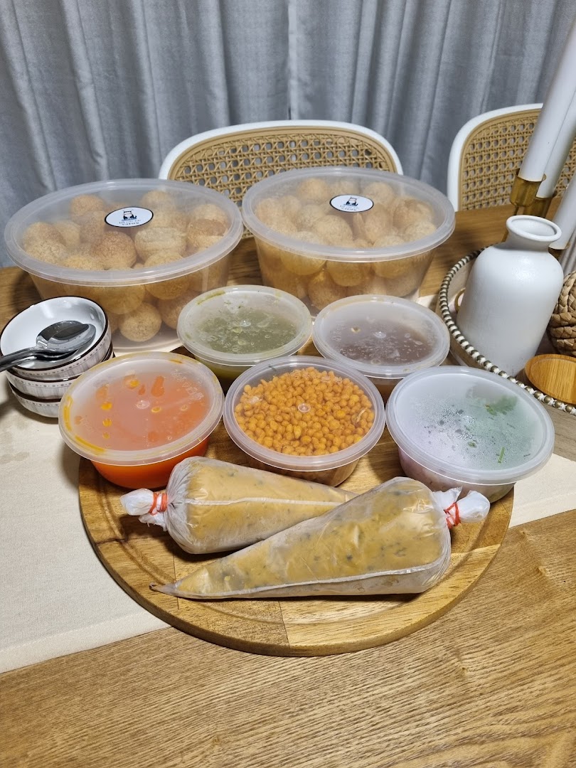 A delightful spread of Indian street food components, including puris, chutneys, and fillings, ready for assembly.