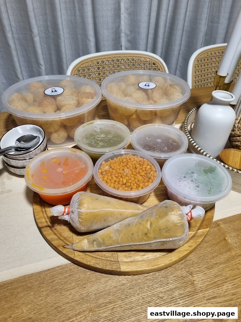 A delightful spread of Indian street food components, including puris, chutneys, and fillings, ready for assembly.