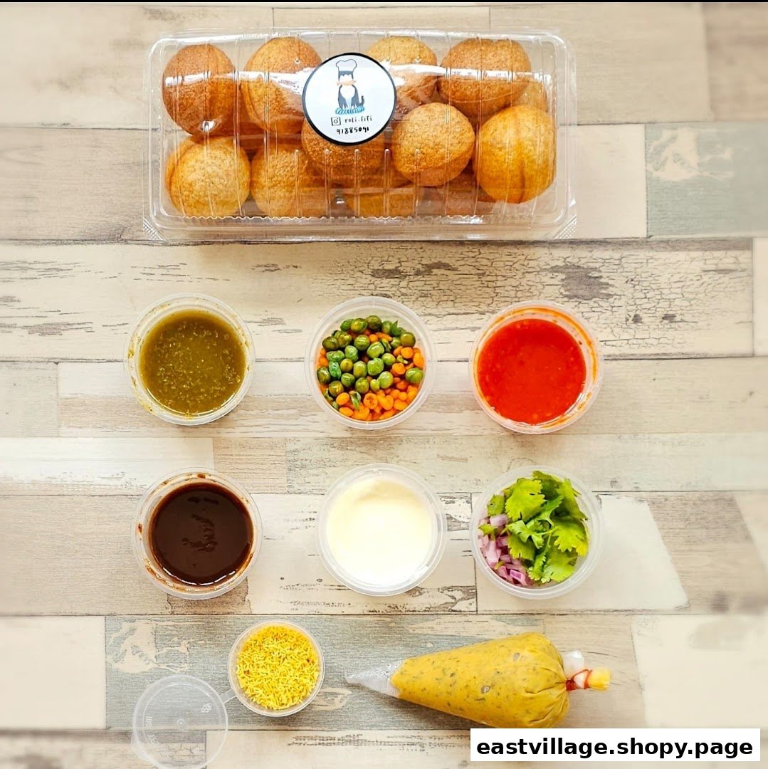 A DIY kit for Pani Puri, featuring crispy shells, various sauces, and fresh toppings.