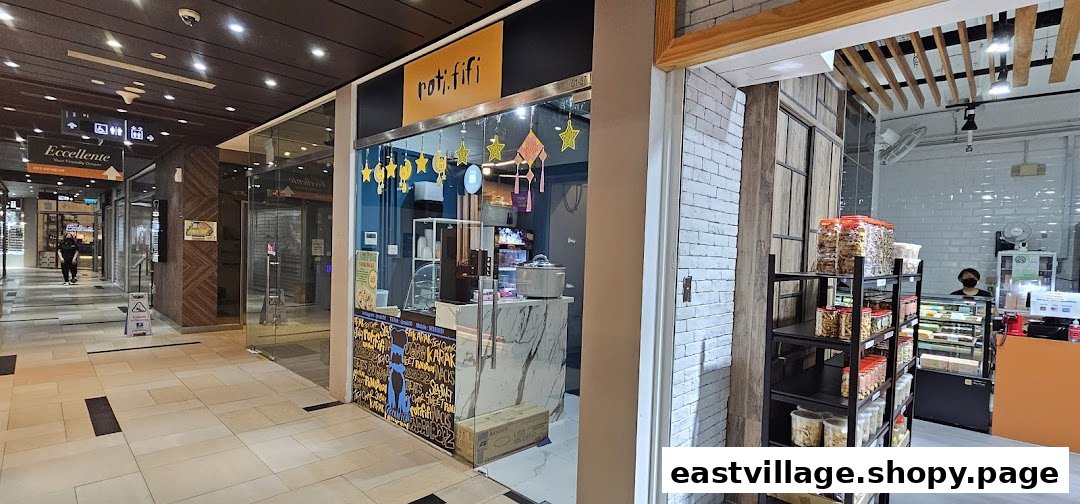 The brightly decorated shop front of ROTIFIFI, a snack and dessert shop, within a bustling mall corridor.
