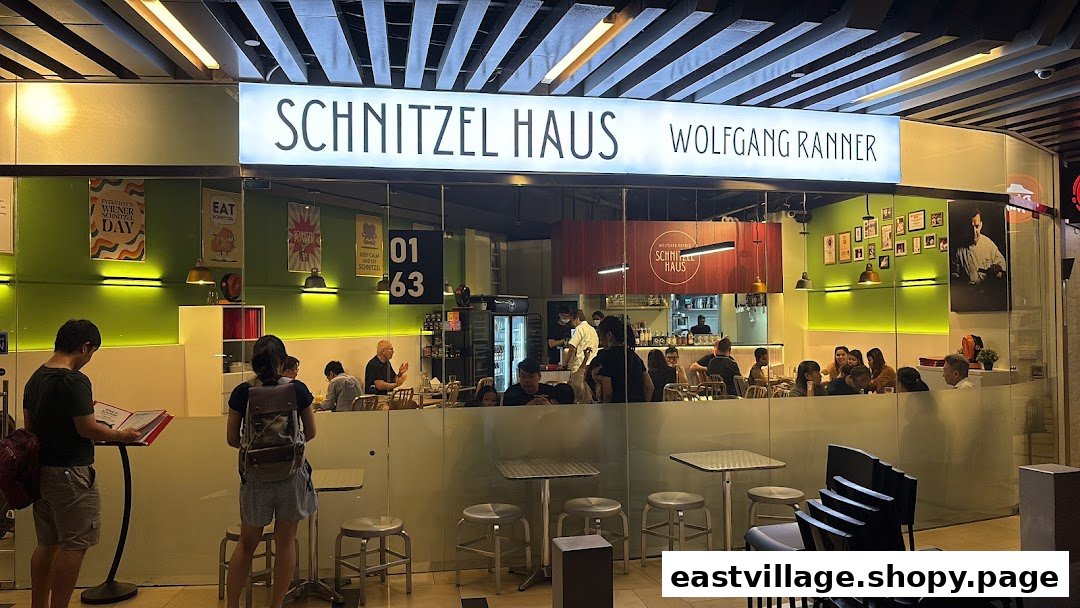 The brightly lit entrance of Schnitzel Haus Wolfgang Ranner, showing customers dining inside.