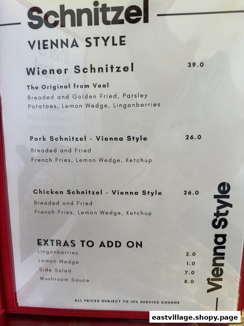 A close-up view of the 'Vienna Style' schnitzel menu, detailing various schnitzel options and add-ons.