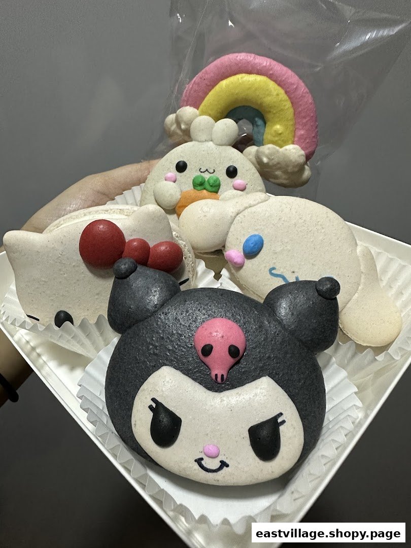 A delightful assortment of character-themed macarons, including Kuromi and Hello Kitty, from Sugarsmith.