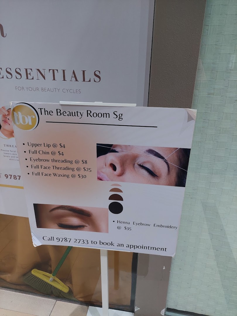 A promotional sign for The Beauty Room Sg, displaying beauty services and their prices.