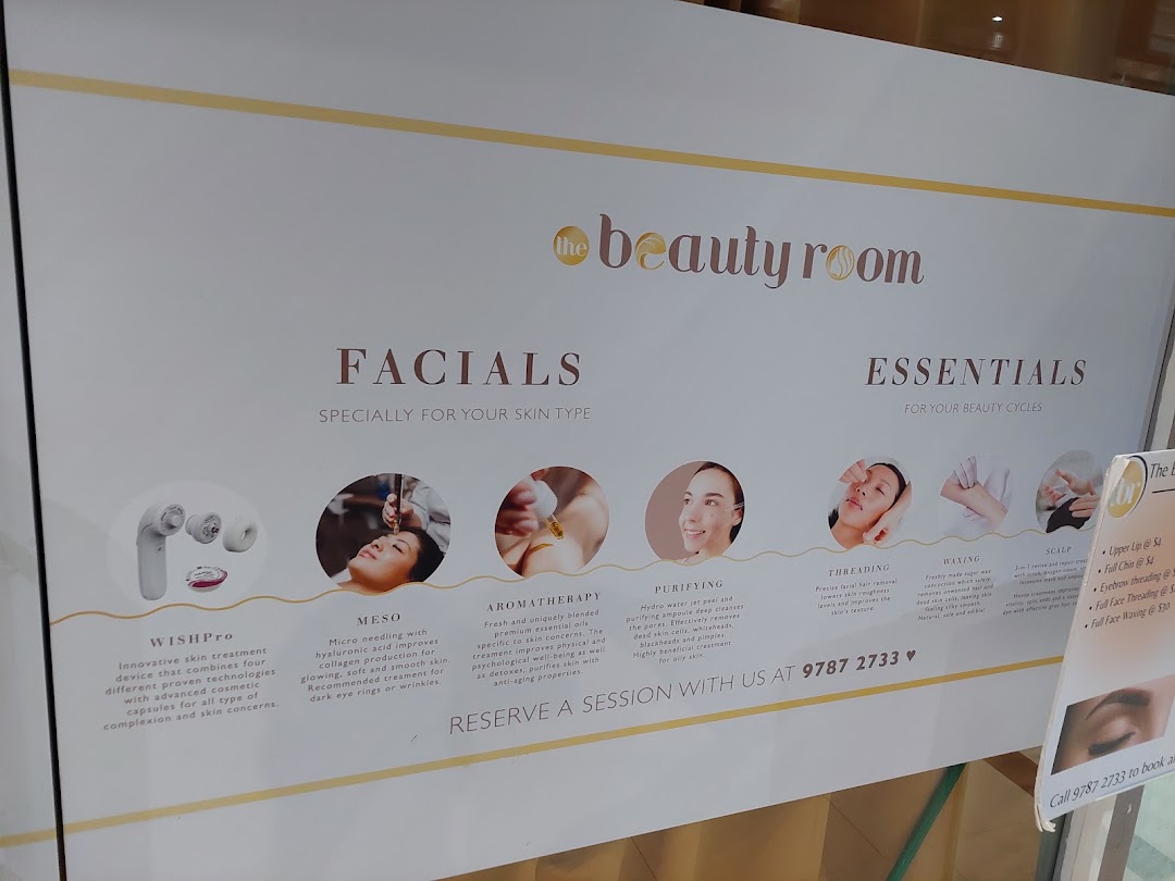 A detailed sign showcasing beauty services like facials, threading, and waxing offered by The Beauty Room.