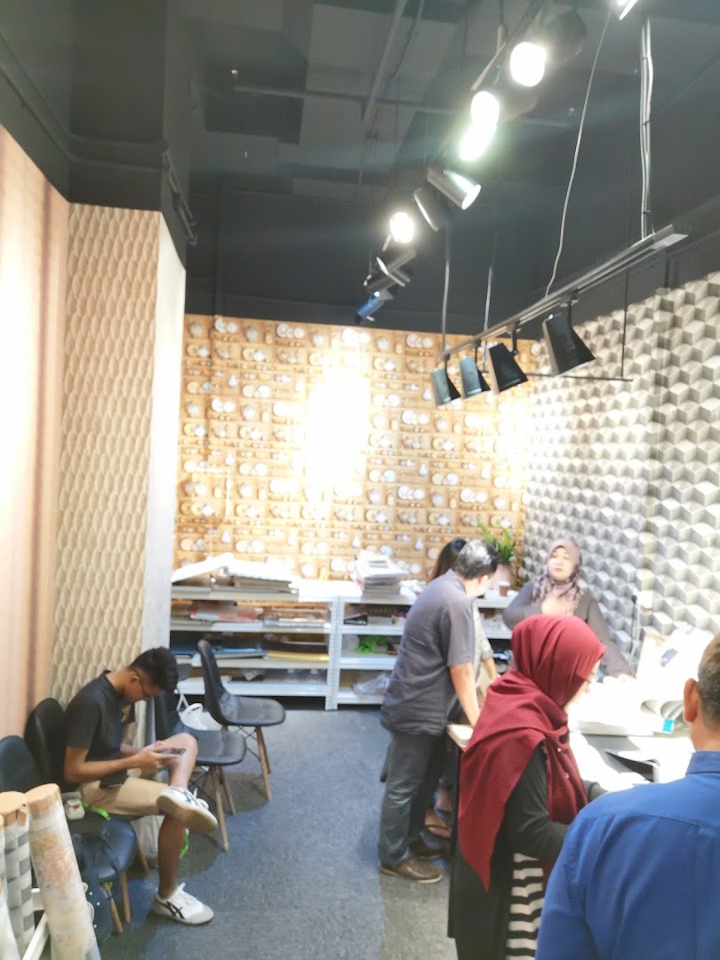 Customers and staff interact within The Catalogue Wallpaper Curtains Gallery, showcasing design options.
