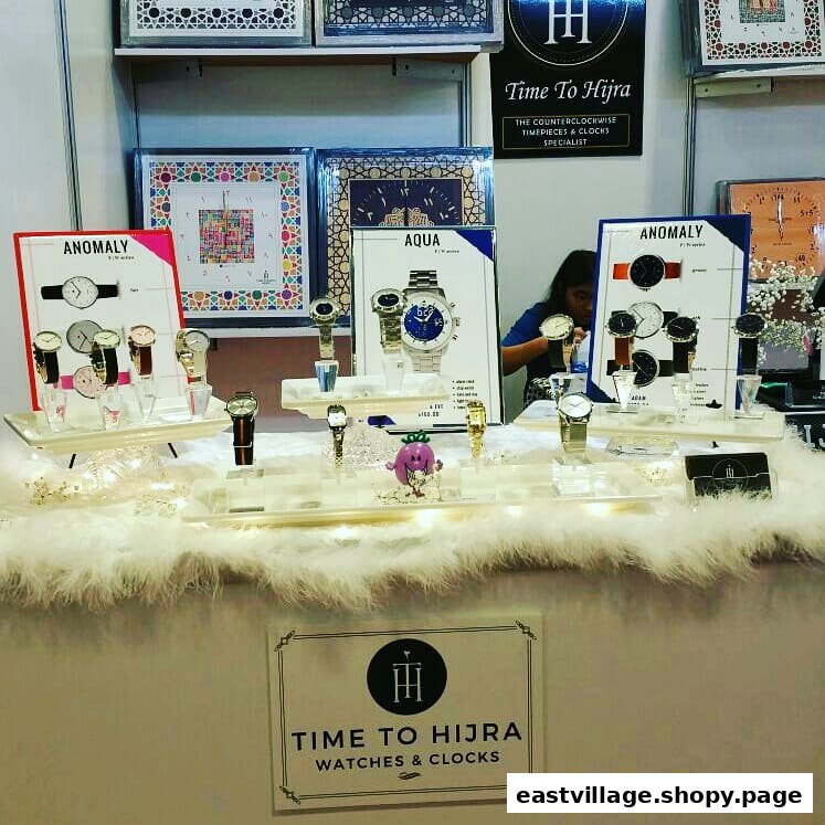 A vibrant display of unique counterclockwise watches and clocks from Time To Hijra.