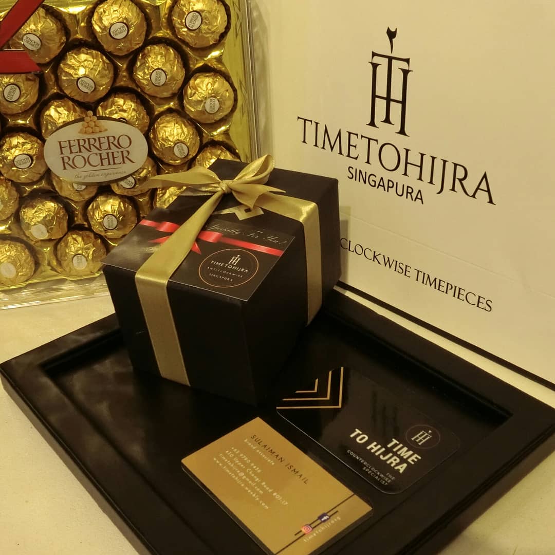 A gift box, Ferrero Rocher chocolates, and branding materials for Time To Hijra, a timepiece specialist.