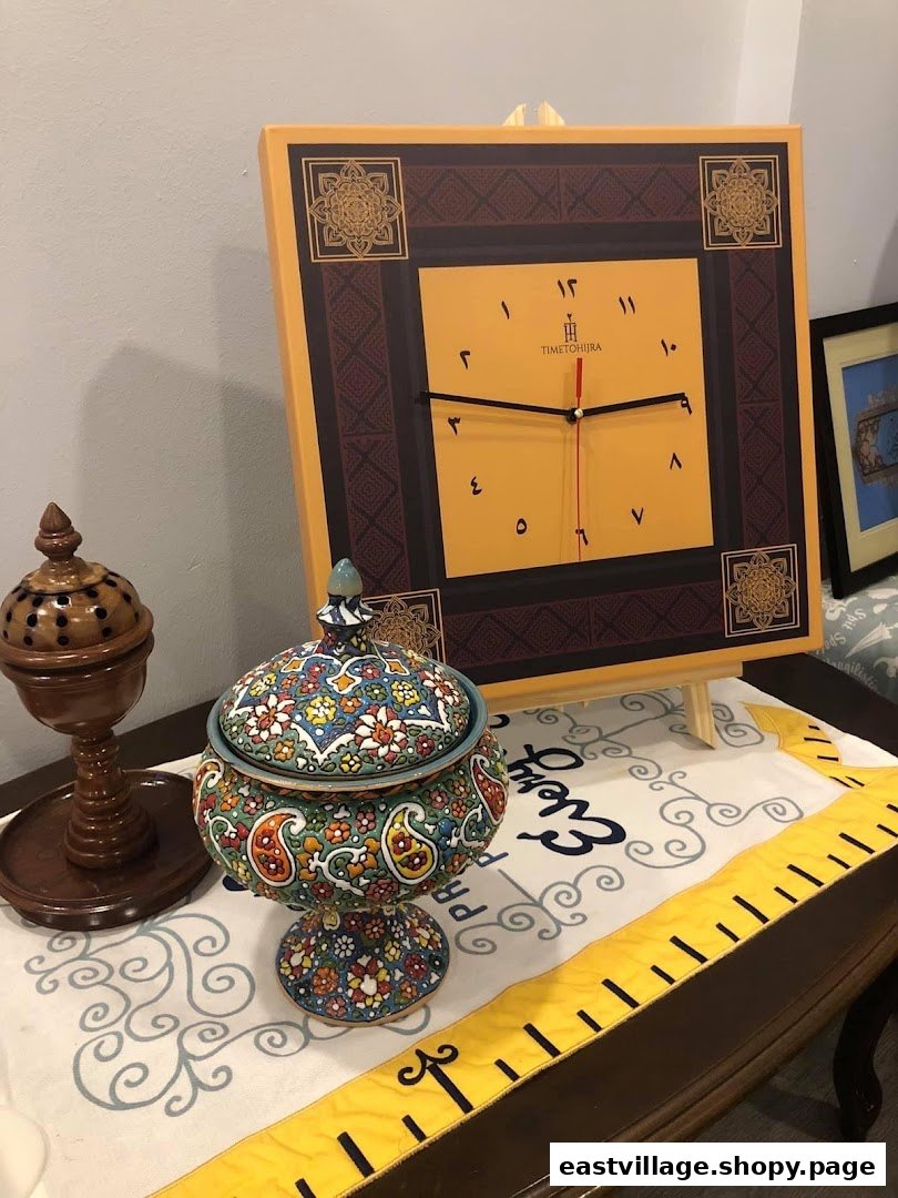 A decorative clock with Arabic numerals, a colorful ceramic pot, and a wooden incense burner on a table.