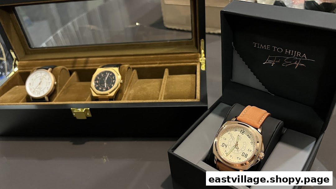 A collection of elegant watches displayed in a watch box and an open gift box.