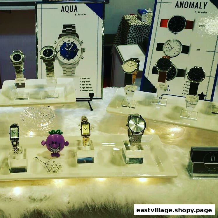 A retail display showcasing a variety of stylish watches from the Aqua and Anomaly series.