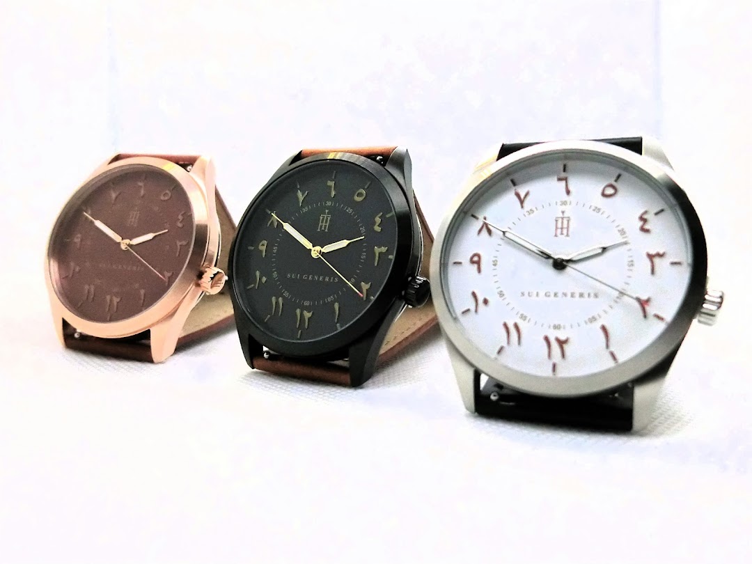 Three stylish watches with Arabic numerals on their faces are displayed, showcasing unique designs.
