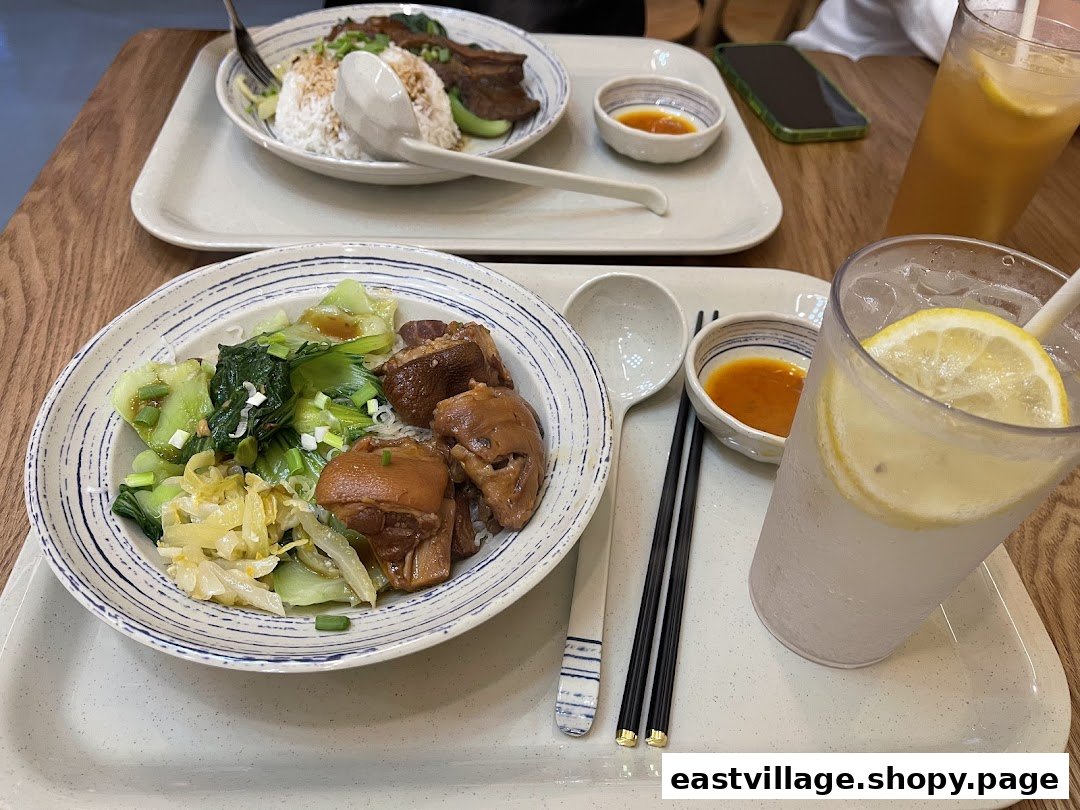 Two delicious traditional Chinese meals featuring braised meats, vegetables, and refreshing drinks served on trays.