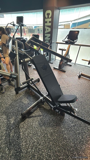 The image shows gym equipment inside 24/7 FITNESS Elias Mall.
