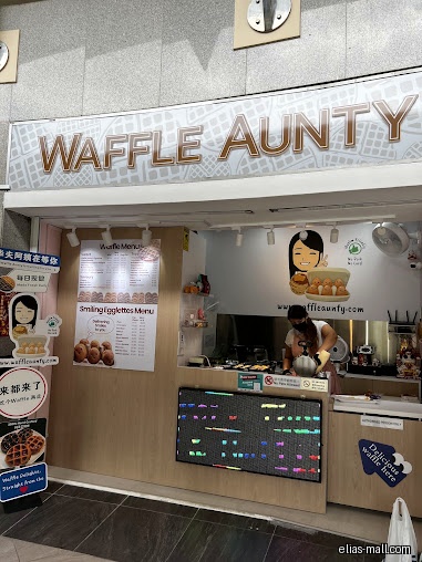 The image shows the front of the Waffle Aunty shop.