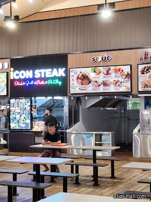 A food court with Icon Steak and Soup stalls and seating area.