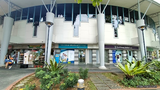 The image shows the storefronts of several shops, including Healthway Medical.