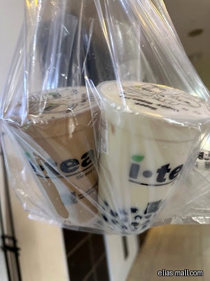 Two iTEA bubble tea drinks in a plastic bag.