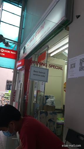 The image shows the front of IZ Hair Studio with an opening special.