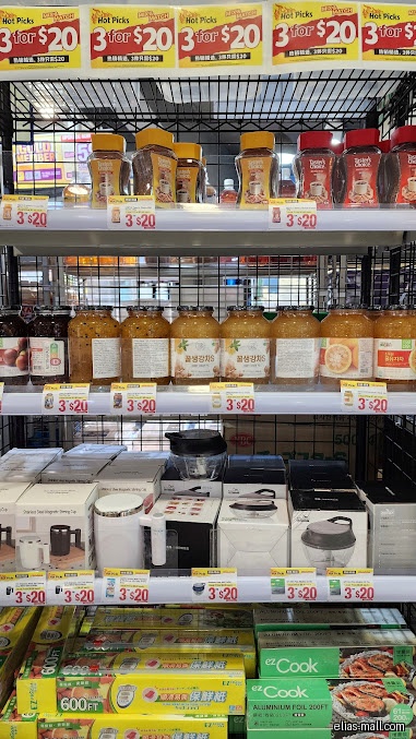 A shelf in Japan Home displays various food and household products for sale.
