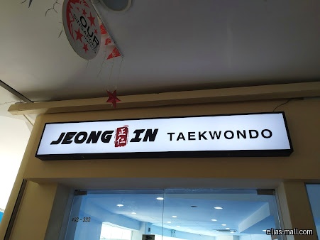 Jeong In Taekwondo shop front with a bright, rectangular sign.