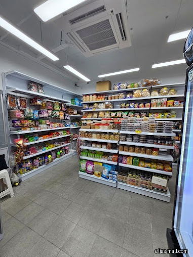 The image shows interior shelves stocked with various food products in a store.