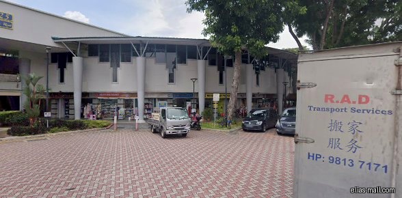 Exterior view of NinetyNine99 Homewares and other shops in a building.