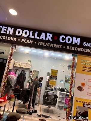 Ten Dollar Salon Group shop front with a person sweeping hair.