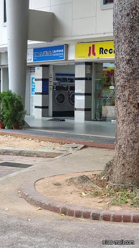 The Wonder Wash laundromat shop front with washing machines visible inside.