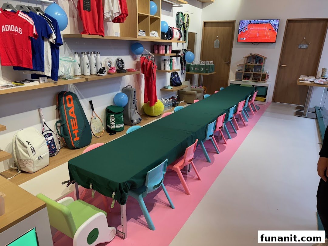 Interior view of Ace Club Tennis, featuring tennis gear, apparel, and a long table set up for activities.