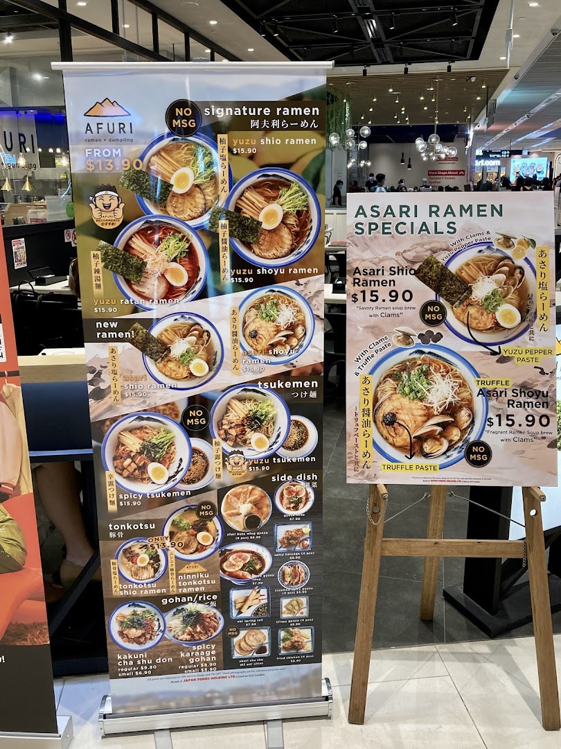 Two large menu boards display Afuri's ramen, tsukemen, rice bowls, and side dishes with prices and images.